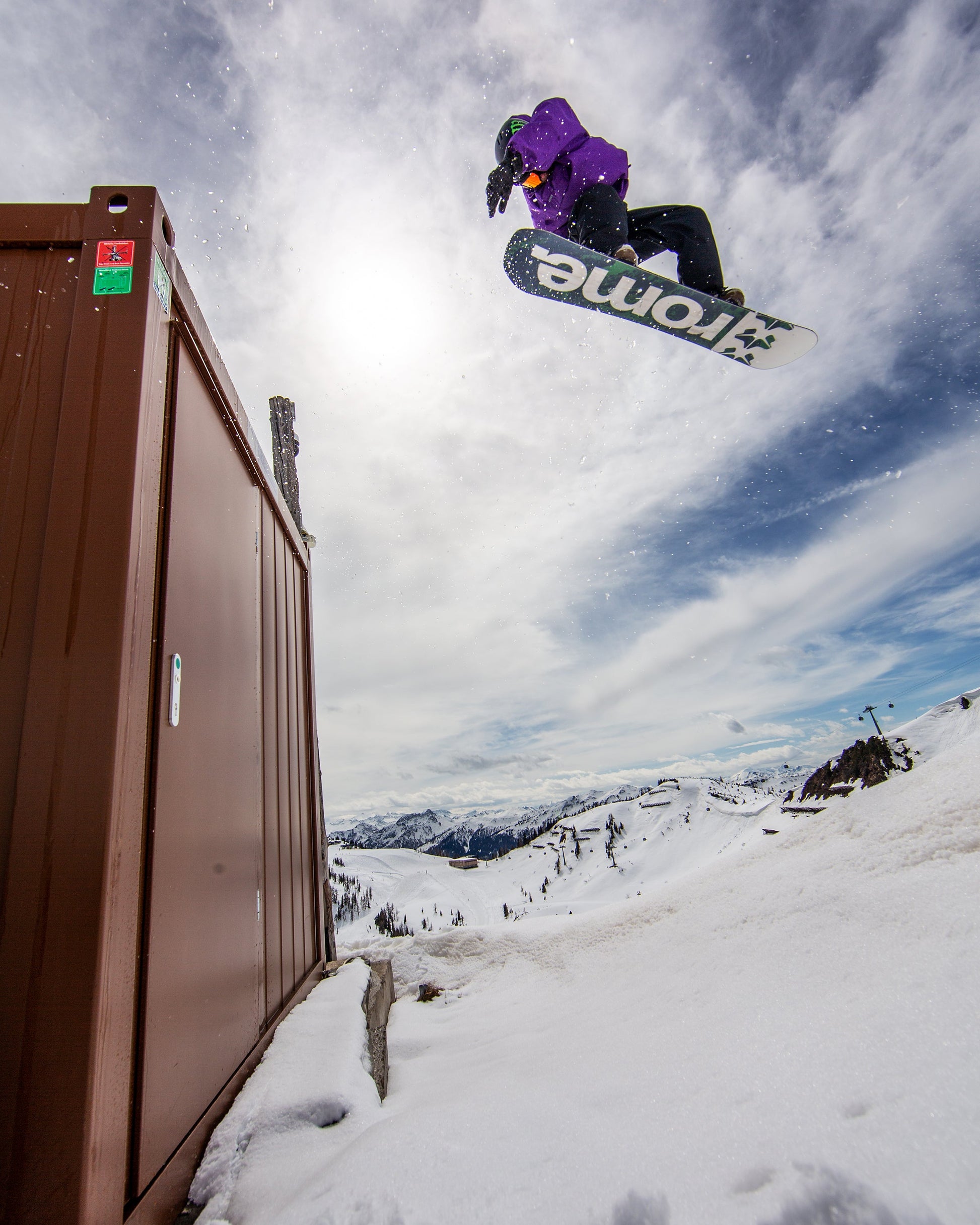Rome Freaker snowboard 2023 action shot container