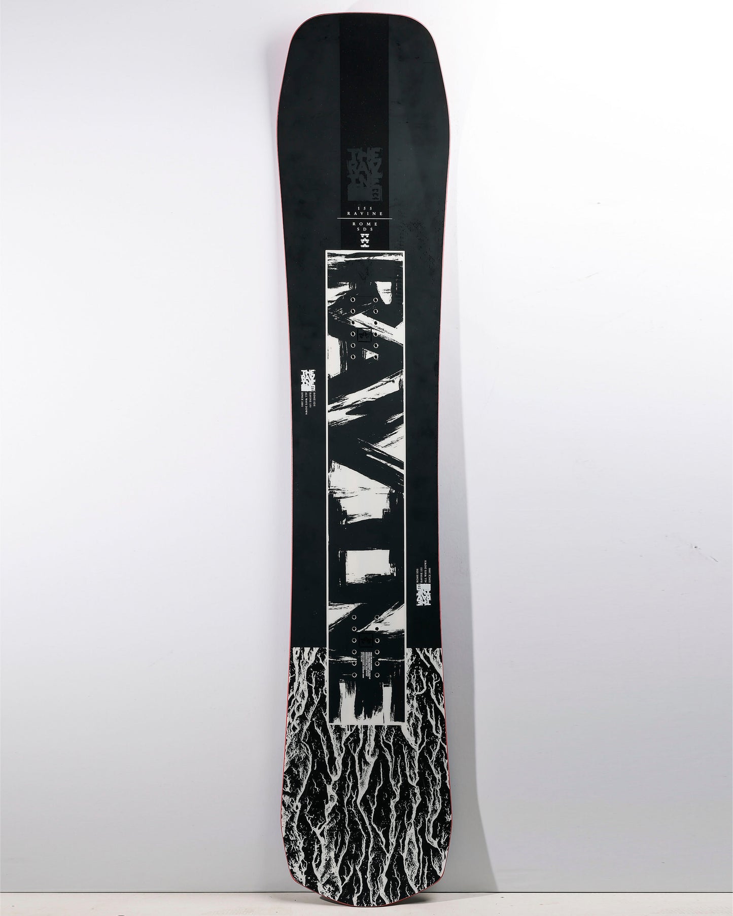 rome ravine 2023 directional snowboard product photo shot from front in studio